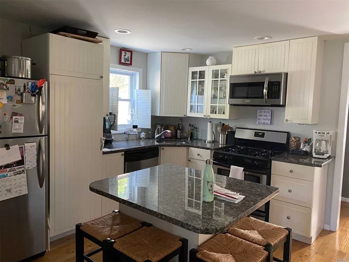 This Beautiful 2BR, 2Full bath Colonial features wood floors, recessed lighting, center island, new kitchen w/granite & SS appliances, including front loaders W/D. half basement , lots of storage, WIC,  Use of yard, 3 car driveway. close to all move right in, won&rsquo;t last!!