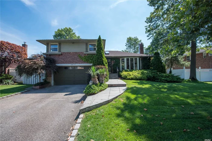 Mint Condition Side By Side Split Level! Beautiful Living Room W/Brick Fireplace, Formal Dining Room and New Eat In Chefs Kitchen With Stainless Steel Appliances, and Gas Cooking. Master Suite W/Full Bath and Walk In Closet. Den With Sliding Glass Doors To A Beautiful Patio And Deck With Fully Landscaped Fenced Backyard. 2 Car Garage. Certainly A Must See!