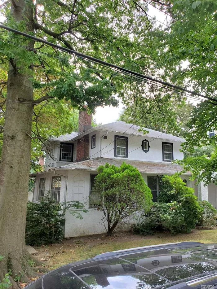 Amazing potential for this huge Colonial/Tudor style home on an oversized lot in the heart of Bayside, Queens. Tons of living space. TWO WORKING FIREPLACES. Very close to all, shopping, schools, transportation, parks and highways. Close proximity the LIRR. Fixer upper&rsquo;s dream. Make it your very own. A must see!!!