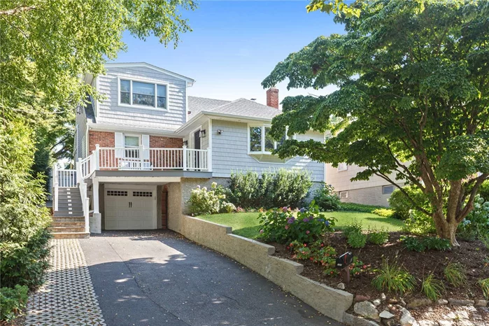 Perched above street level, this completely updated and pristine home perfectly grants privacy, yet is friendly and inviting. The landscaping flawlessly hugs the expanded driveway showcasing illuminated stairs leading up to a front Trex deck. Through the front door, you are greeted by an open Living Room and Dining Room with stunning decorative beams and a fireplace. Continue along to the designer Kitchen with a built-in buffet and sliding doors to the tree-lined backyard. A large Primary Bedroom and Full Bath complete the main level living space. Upstairs you will find 2 additional Bedrooms and a Full Bath. The spray foam insulated basement has 2 rooms that could be used to fit the needs of today&rsquo;s buyers and suitable for a home office.The basement also includes a Full Bathroom, plenty of storage, and access to the attached Garage.