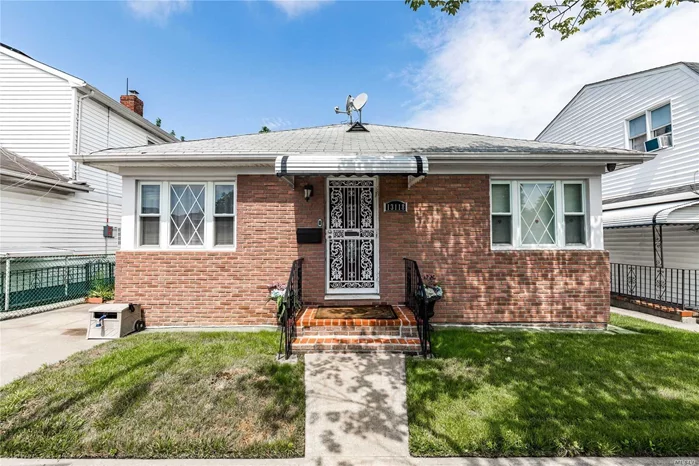 Newly Renovated Kitchen and Bathroom. Hardwood Floors. Full Finished Basement with Family room and Bonus Room, Walk-up Attic used for Storage. Huge Backyard with Pavers.