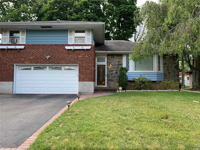 Freshly Painted, Bright And Spacious Split Style House. New Refrigerator, New Oven And More.... High Ceiling, Hardwood Floor . 3 Bedrooms, 3 Full Bath. Large Den Can Be Used As 4th Bedroom Or Office. Finished Basement With Lot Of Storage Closet. Attached 2 Car Garage. Nice Deck And Backyard. Award Winning Syosset Schools. Close To All.