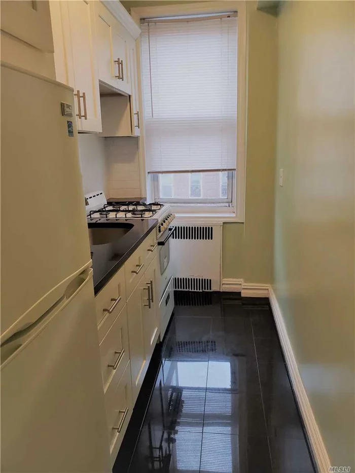 Great Opportunity ** Huge Studio-3 Rooms That You Can Make A 1 Bedroom , Bright And Sunny , Renovated, Elevator Bldg With Laundry Room *** Great Located In Walking Distance To E & F Express Subway Only 20 Min To NYC** Steps To Shopping Area, Restaurants And More.... Must See!!! Sep. Dining Rm, Lg Foyer, Separate Kitchen