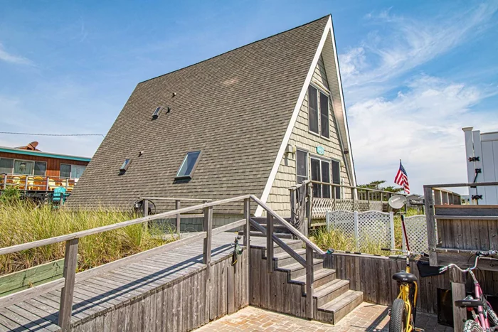Welcome to Paradise! Look no further, this gorgeous 4 bedroom 2 bath year-round Fire Island home is the one you have been waiting for. Was completely renovated in 2006 and sits 2nd from the ocean with no detail missed. Enjoy breathtaking views from EVERY room in this classic A-Frame architectural gem. Open concept floor plan on the 1st story, makes it perfect for entertaining. The definition of indoor/outdoor living.