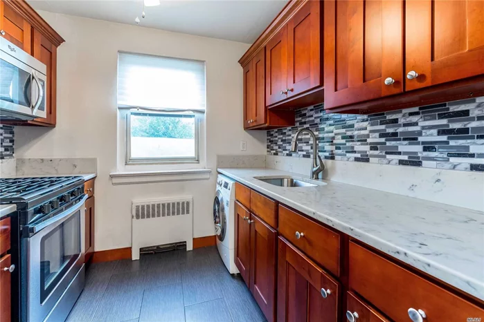 Spacious Upper 1 Bedroom Co-op For Sale Featuring Newly Renovated Kitchen Featuring Stainless Steel Appliances And Cherry Wood Cabinets, Freshly Painted, Convenient Location To Bike Trail, Pets OK, Washer/Dryer Combo, Large Bedroom. Close Proximity To Shopping And Transportation.