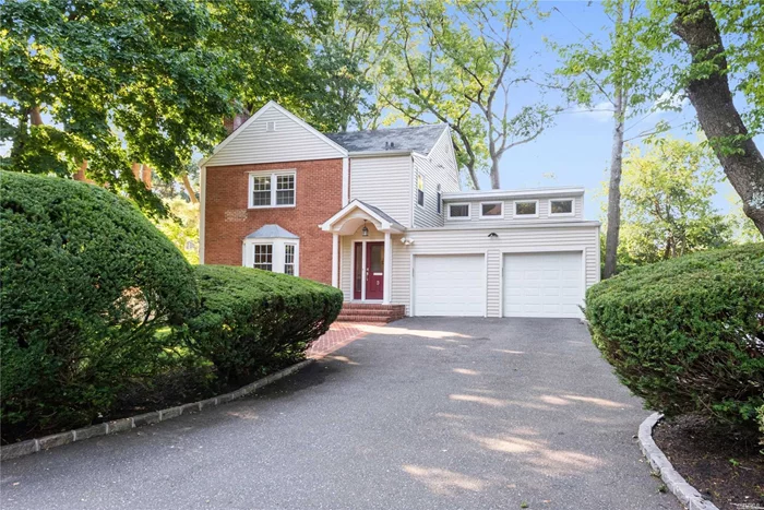 Roslyn. Charming Colonial in the Flower Hill section of Roslyn. 3 Bedrooms, 2.5 Baths, Chefs&rsquo; Granite Kitchen and Renovated Master Bath, Den with Loft area, Wood Floors, Finished Lower Level, Slate Roof, Spa Bath, New Air Conditioning Units. 2 Car Garage. Port Washington LIRR Train Sticker