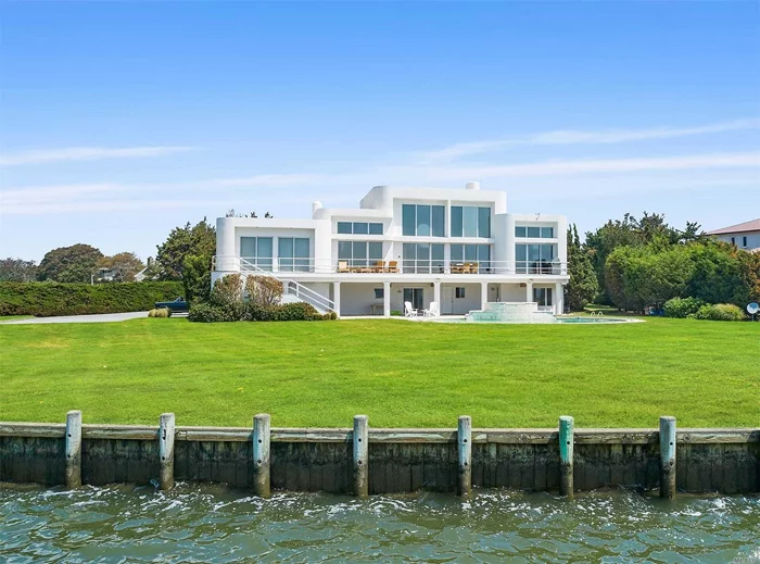 Westhampton&rsquo;s Prestigious ATLANTIC FARMS, This gated modern boasts panoramic bay views with deep water dock on 1.62 bulk headed acres, all weather tennis court, Gunite pool with hot tub. Double Boat Dock. The grand entryway leads to a spectacular Great Room with elevator, granite fireplace and a huge wall of windows that look out to the open bay. The main floor includes a grand master suite with sitting room & bright M/bath with jacuzzi, Chef&rsquo;s kitchen, dining area and 3 guest bedrooms. Ground level has an 3000 Sq. Ft. with exercise room and full bath and room for a Home Theater, Billiard Room 3 Car garage etc.. There is Room for a Second Story expansion for up to 4 more Bedrooms. See Architects Sketches