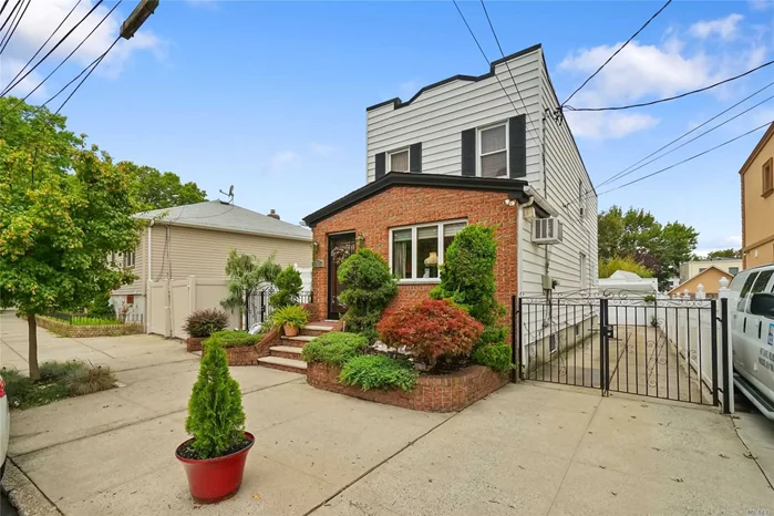 This home is ideally located in one of the most convenient locations in Middle Village. Only a few short blocks to Juniper Park, Metropolitan Avenue, as well as the M-train. Being fully detached with a wide driveway, you have plenty of room to fit two cars in the garage, as well as multiple cars in the driveway. This home is a two family being used as a single family, with one kitchen, living room, dining room and a half bathroom on the first floor. The second floor is three bedrooms and one full bathroom. The basement is finished with a bar which is great for entertaining, a full bathroom, and an outside entrance leading right to the backyard. There is also a side entrance in the front of the house that leads directly to the backyard. There are new hardwood floors throughout the first floor and second floor. The gas fireplace in the living room adds some nice charm, perfect of those cool fall and winter nights. Home comes with AT&T Home Alarm System. Must see in person!