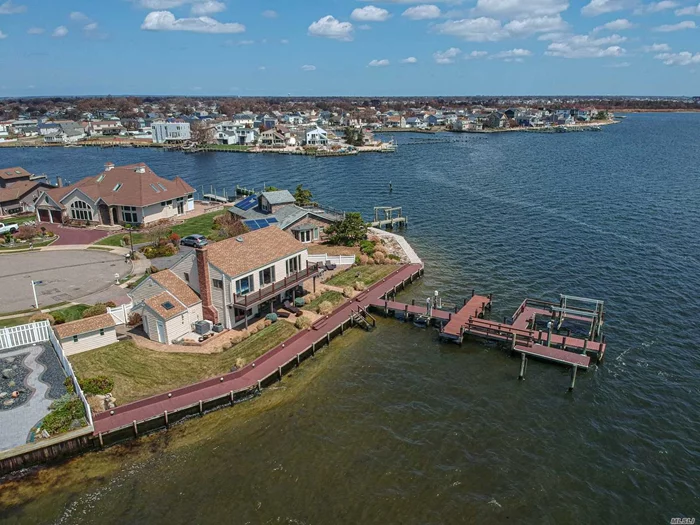 Gorgeous Bayfront Dream home! Stunning Views from every room featuring 217&rsquo; New Bulkhead, T-Dock with boat lift, 2 jet ski lifts, floating dock, Paver patio, Inside you have beautiful Formal entry,  updated kitchen and baths, Formal Dining Area, Living room with custom stone fireplace, Office with outside entry and bath ,  Master Suite with Walk in Closet and Master Bath with Custom Soaking tub and balcony, 2 additional bedrooms, hall bath and 2nd floor laundry room with access to attic (tons of storage!) All on a lovely quiet Cul de sac. Taxes with star rebate $22911.84 This is the one you have been waiting for!-