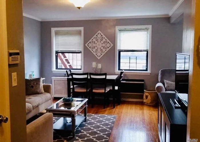 This Beautifully Updated 1 Bedroom/ Jr 4 Coop Unit is Easily Converted into a Two Bedroom Unit if desired. It Features new crown molding throughout the Large Living Room, the 10X7 Dining Room (which can be converted into a Junior Bedroom), and the 13X11 Master Bedroom With 2 Closets And 2 Windows. Additionally, the Kitchen, has a Window and Quartz Counter Tops, nice flooring, back splash, and newer dishwasher. The bathroom also has a window. The Living Room, Dining Room and Bedroom (currently carpeted) all have Hardwood Floors. The Dining Room and Bedroom both have new ceiling fans. Pets are welcome up to 40 lbs. The coop has a Pool onsite. Additionally, a Laundry Room and a Bike Room are in the basement of this build. Only Six Blocks To LIRR Station To Manhattan. Easily walk to Bell Blvd For Shopping, Restaurants, Etc. The Maintenance is $803.25 and there is no flip tax. Electricity is not included in the maintenance. And finally, this coop only requires 10% down payment!