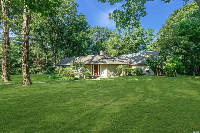 Custom brick Mid-Century Modern 4 bedroom, 2.5 bath Sands Point expanded ranch on a lush one acre property. Located at the end of a quiet cul-de-sac with extraordinary principal spaces highlighting the garden views from every room. Separate 2nd floor loft guest suite. Home office. Full basement with work room and outside entrances. 4 car tandem garage. CAC. Telsa hook-up and more. Best Sands Point Value.