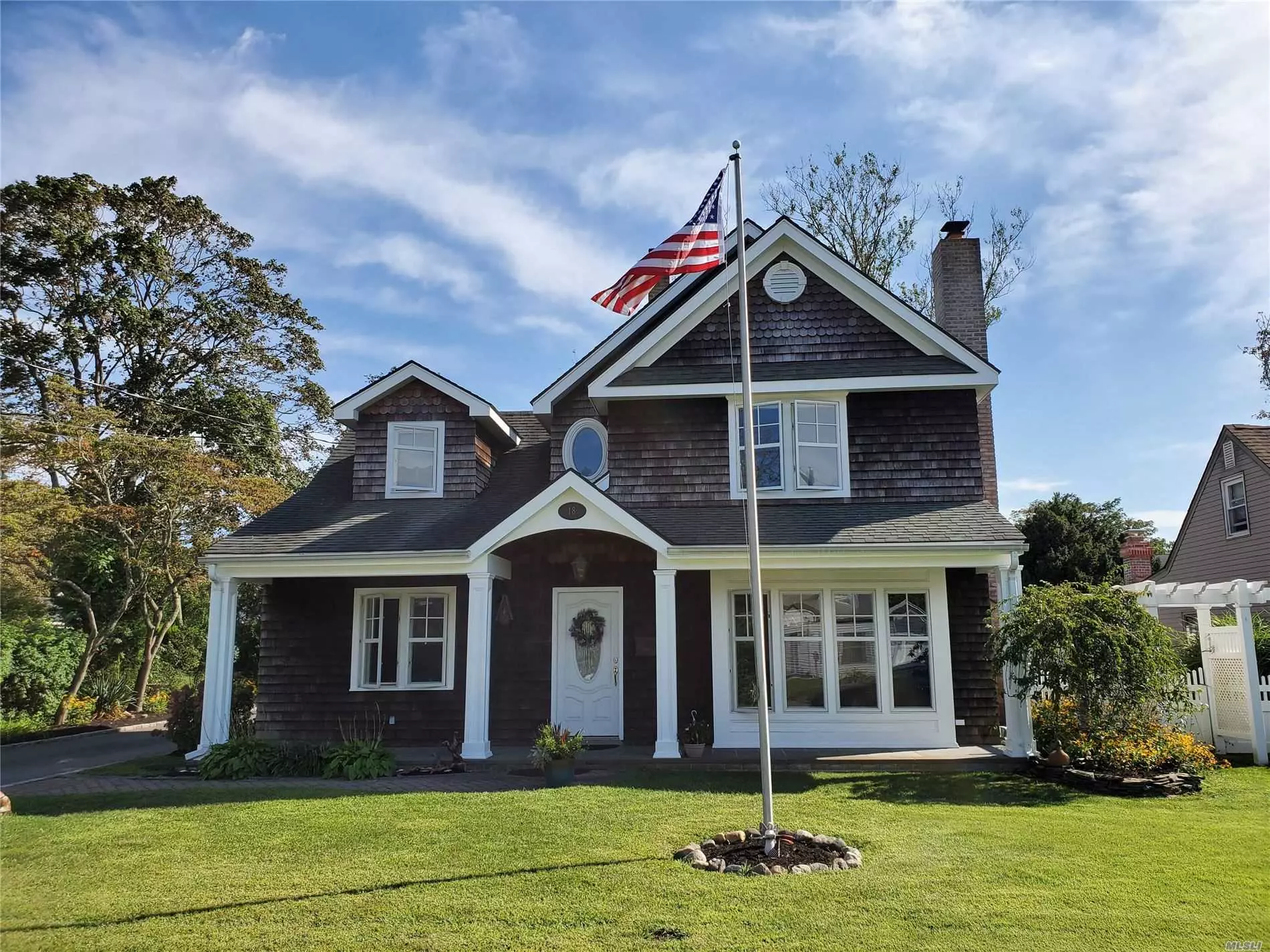 Welcome to 18 E Orowoc Ave in the Historic Hamlet of Islip, New York. This stunning home offers an open floor plan with plenty of room for the whole family to gather or spread out. Featuring a 15 foot Stone Fireplace in the Great Room with Arch windows overlooking the private backyard and French Doors leading out onto the brick and stone patio. Inside we have radiant heat throughout the floors on the first floor which also features a large eat in kitchen, a quaint living room with a second fireplace, 2 nice sized bedrooms and a full bath. Upstairs is the Master Bedroom with walk in closet, full luxury Bath and second large bedroom. Central Air and Hardwood floors throughout. Make this your home for the holidays!!