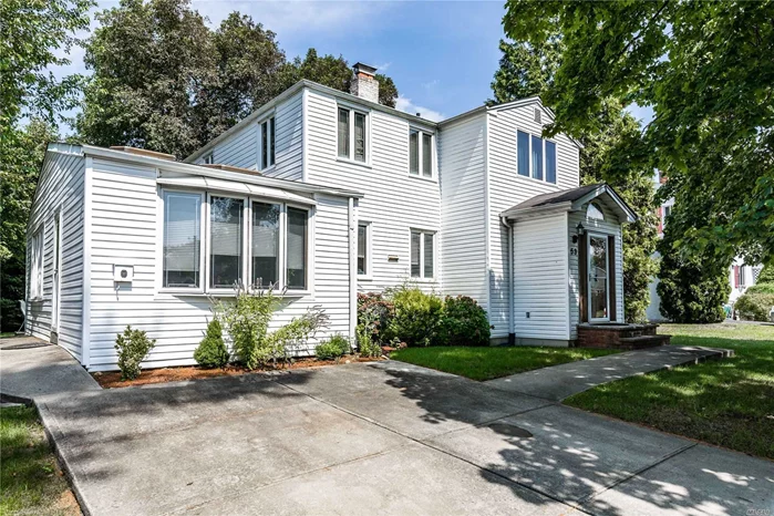 This 3/4 Bedroom 1.5 Bath Center Hall Colonial, In The Herricks School District, Offers Approximately 2300 Sq. Ft. Of Living Space. It has A Large Eat In Kit That Opens Up To The Dining Room & Den with Vaulted Ceilings and Skylights. The Formal Living Room Has A Wood burning Fireplace With A Stone Front. The First Floor Also Has A Half Bath & A Possible 4Th Bedroom if needed, But Is Currently Being Used As A Reading/Workout Area. The 2nd Floor Has A Very Large Master Bedroom & Two Other Large Bedrooms with A Large Full Bath With A Tub And Shower. This 2300 Square Foot Home Also Offers Gas Heat, Cac, Full Basement With An Outside Entrance, And A Large 65X110 Lot.