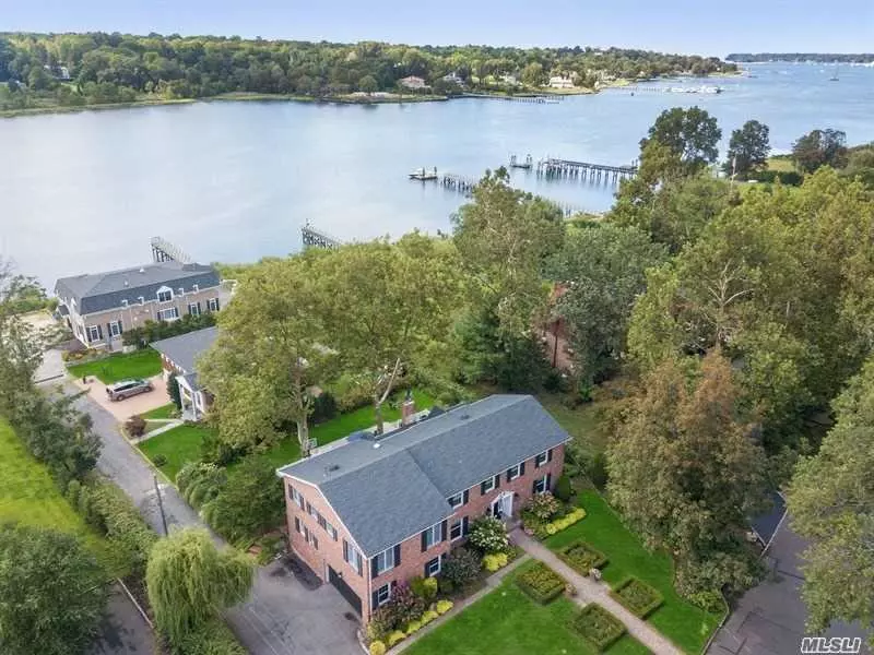 ** 2021 Tax reduction of close to $5, 000! Check out the new low taxes on this home *** Waterviews abound in this classic cntr hall clnl overlooking Manhasset Bay. Grand EF, frml LR w/ gas fp, frml DR, oversized den with panoramic views of bay w/ wood FP, large EIK with custom cabinetry and granite counters, first floor off/BR, laundry and 2 half baths. Gracious primary suite with walk-in closet & ensuite bath, 3 large BRs & BTH, separate Suite with 2nd primary BR/bath and living area and dedicated stairway from 1st floor. Manhasset Schools, close to shopping & LIRR. Come enjoy this Luxury Living live-style!