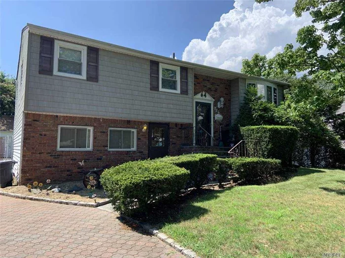 This West Islip Hi-Ranch is Larger than Most! Main Floor Has Typical Living Room/Dining Room/Eat-In-Kitchen/3 Bedroom/Full Bath Layout. 2 Car Attached Garage Converted to Additional Living Space on the Lower Level w/Family Room, Gas Fireplace, Entertainment Area, Sitting Room, Bedroom and Full Bath. Sun Room Added On to Back of House Overlooks IGP. Brick Pavers/Belgium Block Edged Driveway. Separate Detached 2.5 Car Garage. A Lot of House for the $$$!