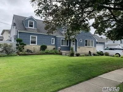 Amazing Extended and Dormered Cape, Spacious & Bright Turn Key corner home Walk to Wantagh RR, Close to Parks, Bike Trails. ( rooms, 4 Bdrms, 3 Fbths, Liv Rm w/Fplc, Master w/Fplc, Updated EIK with Granite, SS Appliances, Updated Baths, Den w/Sliders to Deck, Hdwd Oak Floors. Finished Bsmt w/OSE, Updated Spa Baths, Attached 2 Car Garage. Top Rated Seaford SD. Playroom/Theater. Attached 2 Car Garage. Solar Panels = 13% of Electric.