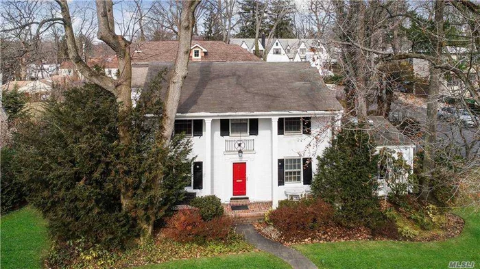 Spacious and Classic Brick Georgian Center Hall Colonial in Great Neck Village. This Beautifully Appointed Expanded and Extended Home Features 5 Bedrooms, 4 Updated Baths, Large Granite EIK w/ SS Appliances, Home Library, Den, Living and Dining Room with dual custom mantel fireplace, windows galore, finished basement, 2 car garage, Baker Elementary and North Schools