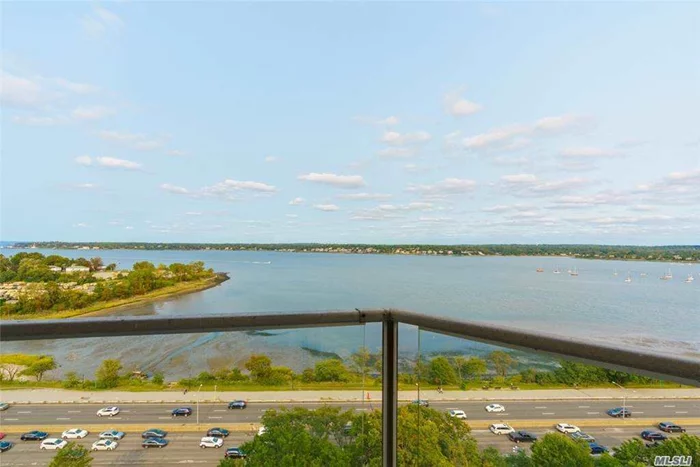 Watch the sailboats and the sunrise while enjoying the panoramic views of the Little Neck Bay. Rarely available corner unit faces the water and overlooks Long Island and beyond. Modern pass through kitchen and dining area opens to the oversized balcony off of the living room. This unit has boundless possibilities with ample closet space and three large bedrooms including an ensuite master with private second balcony. Luxury building in the heart of Bayside with tennis, pool, garage parking, full time doorman, laundry facilities and onsite shopping.