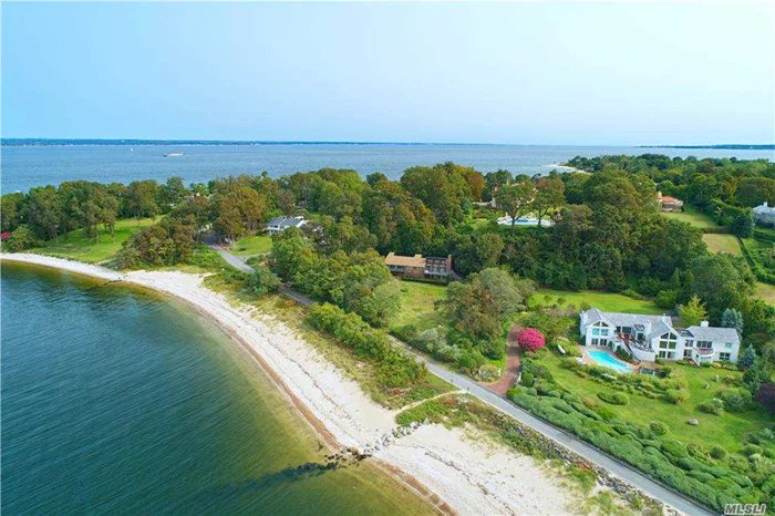 PRIME BEACHFRONT OFFERING Best waterfront value in Sands Point, 180 degree views of Manhattan. Enjoy beach living with magnificent sunset views on your private extra wide beachfront! This contemporary style residence consists of 2.68 acres in total ( 2.1 acres of land and .58 acres of private beachfront ), 4 bedrooms, 2.5 baths, separate office, open great room with high ceilings, fireplace, walls of windows, 3 exposure, overlooking beautiful sunset views. Walk-out lower level, attached 2 car garage, and private driveway.