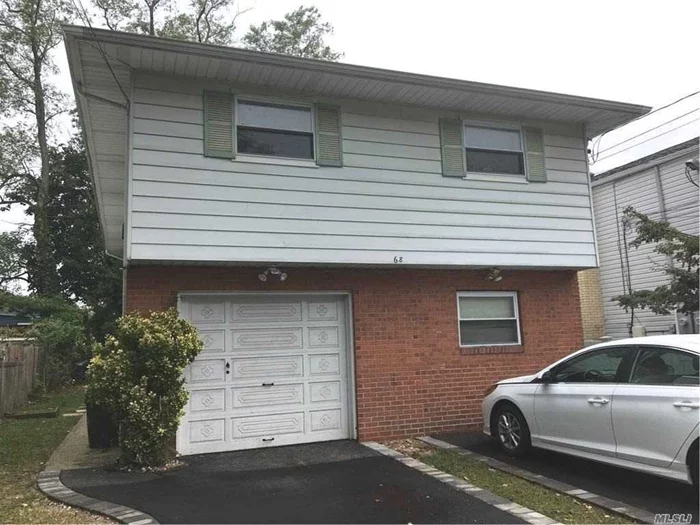 Two Bedroom Second Floor Apartment with Brand New Laundry Room and Storage Space. Living Room, Eat-In Kitchen, Hardwood Floors. Shared Backyard; Driveway Parking. NO GARAGE SPACE. Close to Manorhaven Community Park, Beach and Pool.