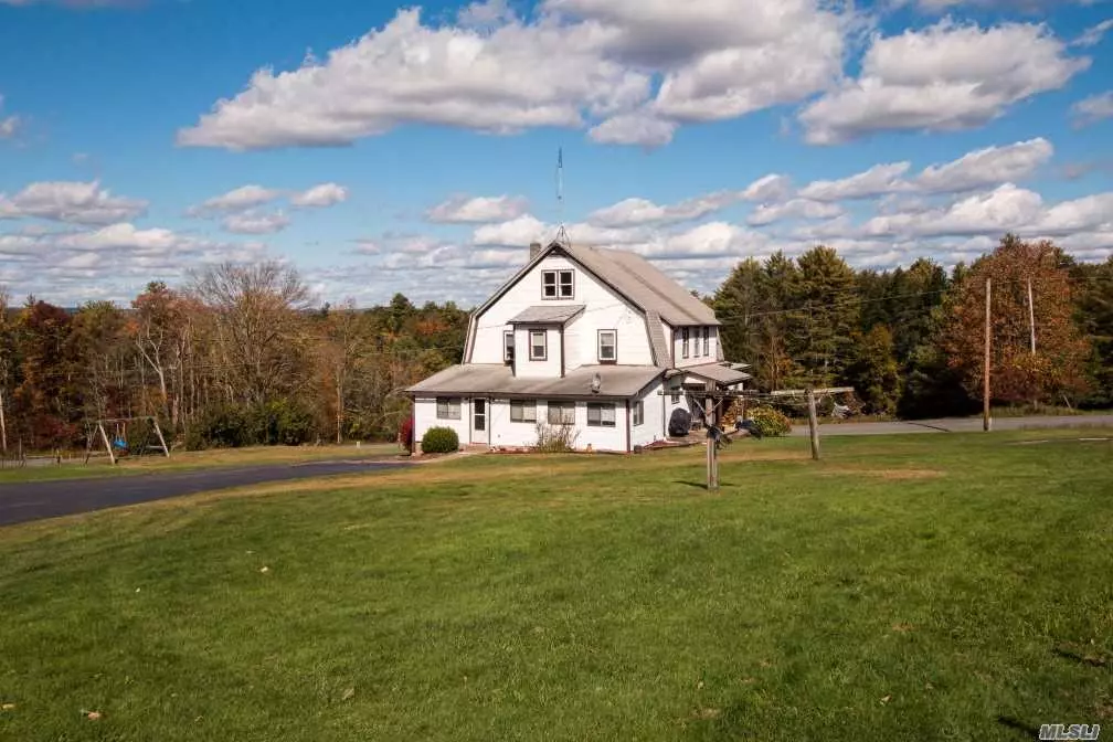 52 Acres featuring Single Family Home, In-Ground Pool, 3 Car Detached Garage with Storage and Barn.