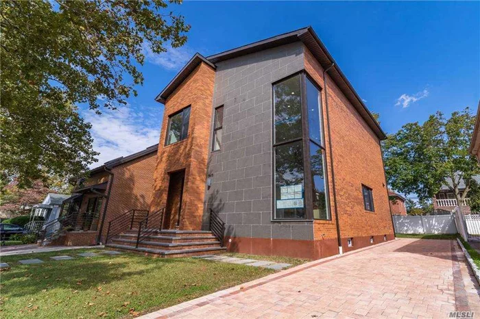 Brand New and Stunning Contemporary Brick House located in Bayside. This home has about 4625sf in lot size and 2400 sf of interior space. First floor features a foyer, living and dining area with double-story open floor plan, Eat-In Kitchen w/quartz counter-tops and custom cabinets paired with high-end appliances, a guest room and a full bath. Second Floor features Master suite with Master bath w/free standing tub and custom staircase leading to a fully finished attic for closet space,  additional 2 bedrooms with a Full bath. And also there is a fully finished basement with a separate entrance, a full bath. Heated Floors, Split AC, and Much more! SD # 26.