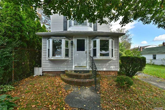 Charming Colonial Set On Oversized 50x150 Property In Baldwin. This Home Features Ac, Eik, Formal Dining Room, Living Room W/Wood Burning Fireplace, Master En-Suite W/Full Bath & 2 Closets, 2 Bedrooms, 1.5 Baths, Den, Full Basement W/Laundry & Utilities, 1 Car Detached Garage, Fully Fenced Oversized Private Yard Perfect For Entertaining.Close To Schools, Shopping, Restaurants & Transportation.