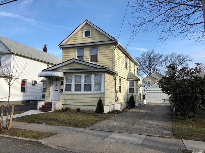 Legal 2 Family features 3 bedrooms, 2 bths, hardwood floors, Detached 2 car garage, full basement, new gas boiler, close to transportation, shopping and LIRR, 24 hour notice.