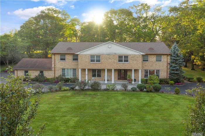 Sprawling brick colonial on two acres in the prestigious Village of Old Westbury. Set back, the home boasts a long, &rsquo;U&rsquo; shaped driveway perfectly landscaped with perennial shrubs and year-round color. The automatic, rod-iron front gates add total privacy to the spacious, front-yard. Inside, the home features a grand foyer with high ceilings. The first floor includes a powder room, living room, formal dining room, sunken family room with fireplace and completely remodeled eat-in kitchen with center island, marble countertops, two sinks, double ovens and Sub Zero/ Wolf appliances. Adjacent to the family room is a temperature controlled screened-in porch with an above ground Endless Pool. Also on the main level are three bedrooms. Upstairs features a common area with a bar, three large bedrooms, two full bathrooms and a huge master suite. The flat, park-like backyard includes panoramic views of a country club golf course, a fenced-in pool, an entertaining patio and an outdoor kitchen