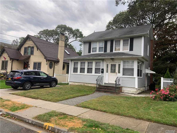 Perfect for 1st time buyers; property is 3 bed plus attic, 2.5 baths w/half bath on 1st floor. Full finished basement with 1 full bath, living area, bedroom, and separate entrance; roof is 10+ yrs old; 40 x 125 lot size. short walk to LiRR/Sunrise Hwy;