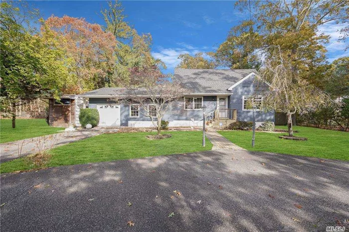 The Circular Driveway Leads you into this Beautifully Expanded Cape in Islip Schools with First Floor King Sized Master W/ WIC and Large Main Floor Full Bath. The Upper Level Has Two Renovated Bedrooms/Office Space and a Full Bath with Air Jetted Tub.  Home Boasts a Large Eat in Kitchen with Space for Formal Dining. Step down into the Expanded Living Room with Wood Burning Fireplace with Insert Which Leads Either to the more than 2 Car Length Garage with Home Gym Space or Outside to a Peaceful Patio with a Large Fully Fenced Yard that Borders Tree Filled State Land. The Legal Partially Finished Basement with Wetbar and Full Bath can be Accessed from Inside or through the OSE. Come See All the Opportunity in this Expanded Cape!