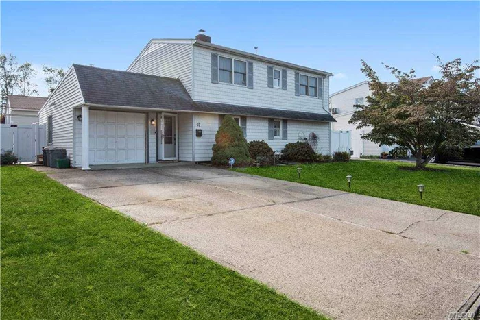 The inviting partially opened floor plan of this lovely colonial features a large living room and dining room equipped with a wood burning fireplace, large eat in kitchen and spacious laundry and pantry area. Five large bedrooms with newly laid carpeting along with two updated bathrooms. Central air conditioning and 4 zone heating along with a list of other recent updates make this home an absolute treasure in the heart of Island Trees.