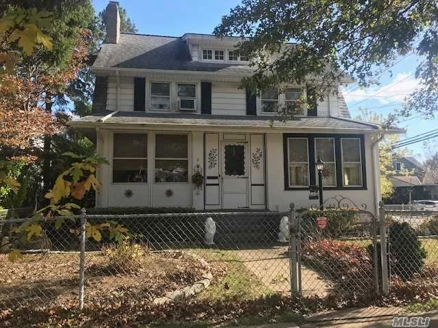 Charming Center Hall Colonial, This home features, 4BR&rsquo;s, 2 bths, Living Rm w Fireplace, FDR, Kit, Enclosed front porch, Full basement, Full walk up attic. Home is being sold As Is. Great location in Lynbrook school district, short distance to LIRR, shops, schools, parks, & restaurants.