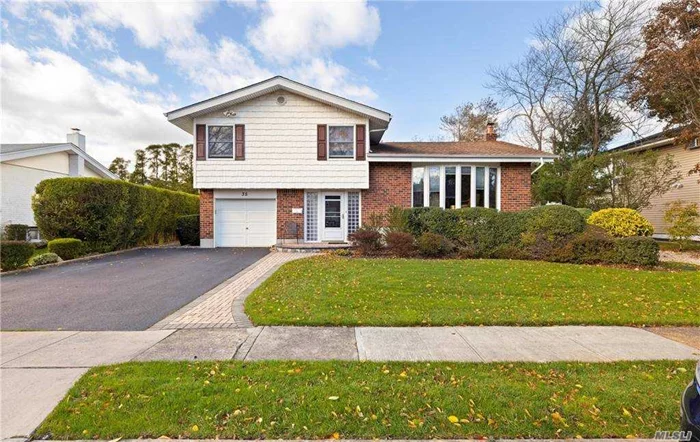 ***Open House Cancelled 12/27**Split in the Heart of E. Birchwood. 4 Br 1.5 Bath, EIK, HWFloors, Updated kitchen cabinetry and beautiful SS appliances. Full Basement, Syosset Schools District. Quiet block with close proximity to all. Expansive yards with year round privacy. Great location 28 mi. to NYC, 7 min to train stations , 15 min To TOBAY beach & Roosevelt Park with Bay Beaches and Tennis****Taxes with current owners STAR Exemption is $19, 023.60 driveway with brick work porch- installed in the last 3 years *Back brick stoop with railing - installed in the last 5 years *Sprinkler system-upgraded in the last 3 years *Central AC-installed in the last 5 mo. *Boiler and re-constructed chimney - installed in the last 2 yrs *Roof-installed in the last 12 yrs - 30 yr warranty *Doors and windows - installed in the last 7 years *New kitchen cabinetry and appliances (current extended warranty)-installed in the last 8 years *Wood flooring installed in the last 7 years *Bathroom updated