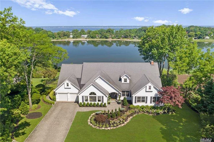 Savor The Sunsets Year Round At This Exquisite Custom Waterfront 5 Bedroom Colonial! Formal Living Room w/ Vaulted Ceiling Captures Stunning Water Views w/ Walls Of Windows. Chef&rsquo;s Kitchen w/ Top Of The Line Appliances Opens To Den w/ FP & Movie Screen w/ Glass Doors Which Open To Epay Patio For Outdoor Dining. Formal Dining Room w/ High Ceilings Perfect For Entertaining. Spacious Master Ensuite w/ WIC & Deck Overlooking Dosoris Pond. Lower Level w/ Great Room/Entertaining Area w/ FP & Full Bar Boasts French Doors To Pavers Patio & Saltwater In ground Gunite Heated Pool. Full House Generator. Bocce Ball Court, Regulation Sized Pitchers Mound. Water Purification System. Don&rsquo;t Miss This Wonderful Opportunity To Own One Of The Finest Long Island Waterfronts!