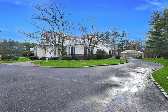 Diamond Stucco House Luxury Renovated 5 Years Ago. New Roof, New Windows, New Bath, 2.4 Flat Acres on A Cul-de-Sac. Open Space. Good For Entertaining. Pool, Tennis Court, Gazebo, Indoor Garage and Outdoor Covered Garage. Quiet and Conveniently Located on a Cul-de-sac easy access LIE.