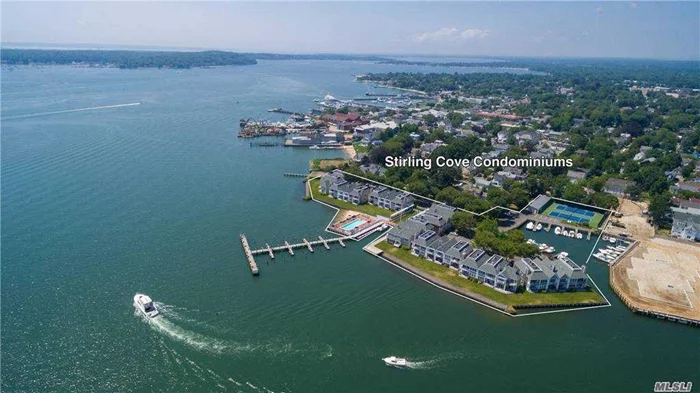 First floor end unit in coveted Stirling Cove Condominiums. Open floor plan with two bedrooms, two baths, wood burning fireplace, large deck, and deeded dock in protected boat basin. Complex offers heated in-ground pool, tennis courts, private beach, all just a short walk to Greenport Village business district. Near Islands End golf course and access to all that the North Fork has to offer. Full-time on-site management.