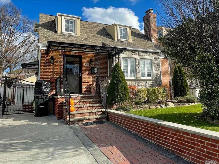 Detached, solid brick, spacious cape in excellent condition. Quiet, yet convenient location on a one-way street off of Union Turnpike. This home features a total of 4 bedrooms, modern kitchen and baths, beautiful h/w floors, split AC units, inground pool, detached 2-car garage and more. Exceptionally well maintained home close to supermarket, local shopping and mass transit (Q46, Q31, Q30 buses). Zoned for school district #26; PS 173 and Jhs 216.