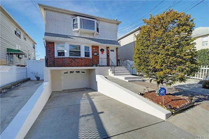 Here is your opportunity to own a 2 family Hi-Ranch in Bayswater section of Queens. This renovated home sits on a 37 x 150 lot with a private driveway and 1 car garage. The first floor features a large 3 bedroom apartment with living and dining rooms, an updated kitchen, and a full bath. The second floor, with private access features a large living and formal dining rooms,  2 large bedrooms, an updated kitchen, and a full bath. Interior and exterior access to the finished basement recreation space with 1/2 bath, and laundry room. Fenced in property with new pavers and cemented front and side yard, plus a cozy and private back yard with paved patio,  and cabana for privacy. Minutes to A train, easy access to Five towns shops, Rockaway and Atlantic beach, and boardwalk. This home will be delivered vacant when sold.