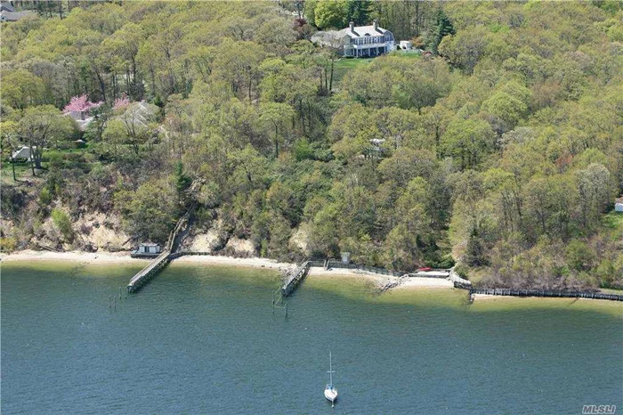 DIRECT WATERFRONT WITH OWN DOCK! Enjoy spectacular views of Cold Spring Harbor from this beautiful 5-bedroom, 5.5 bath stone & shingle residence with 3 full levels of living space. Features spacious rooms, high ceilings, 4 fireplaces, elevator to all levels, generator and 3 car garage. Set on 4.2 acres with heated in-ground pool, private dock, beach, beach storage shed as well as Village Of Laurel Hollow Beach. Taxes have been grieved and will reflect an approximate 39% reduction of general & Village taxes in April 2021 as well as a additional reduction in the 2021/2022 school taxes.