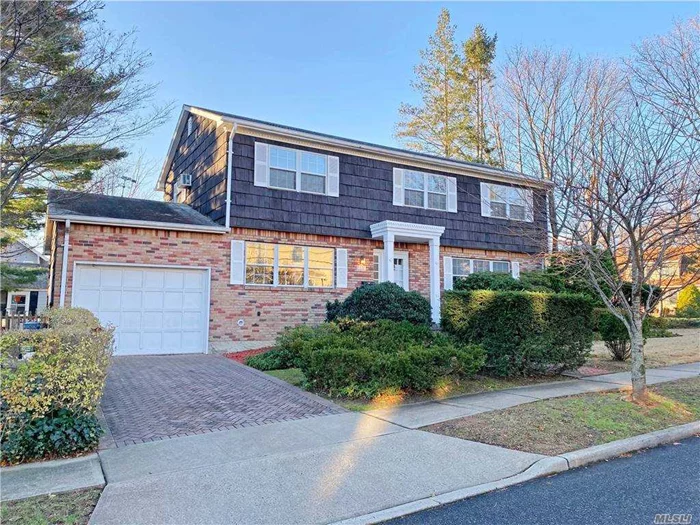 SPACIOUS CENTER HALL COLONIAL - refreshed and ready to move in! Living room w French doors leading to exterior property, family room w fpl, dining room, eat-in Kitchen w access to 1 car garage and side-yard. Primary bdrm w en suite bath, 3 add&rsquo;l bdrms w large hall bath. Multiple closets, including 3 linen. Expansive basement with playroom, laundry, utility and shop area - plus large additional space for hobby, office, exercise, storage. Ideally located on charming Village block - close to LIRR, Shopping, Library, Parks and Schools. Nearby Town beach, golf course and pool.