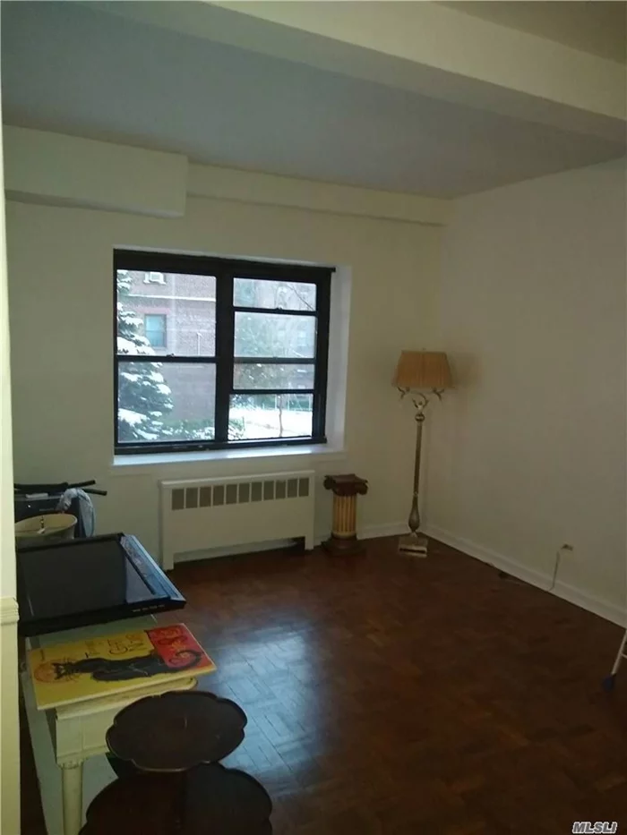 Ready to move-in! Great opportunity to live in highly sought after area and building. Beautiful Maspeth Plateau providing views of Manhattan skyline and nearby parks. Great layout. 2-bd, 1-ba, large living rm/Dining area, Eff kitchen. 2 good size bedrooms. On an inclined street with 2 entrances to bldg, thru front entrance, 2 levels down from back entrance, walk-in level. Hardwood fl throughout. Lots of cabinet. laundry facilities. Elevator bldg.