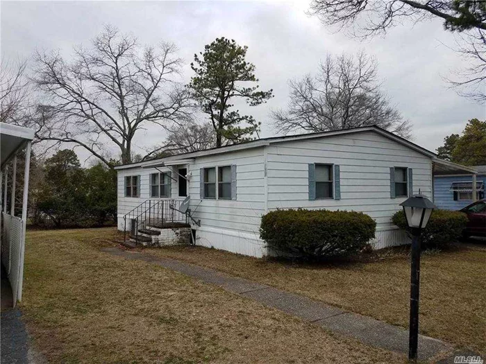 Very Nice Double-wide Mobile Home w/Carport and Ramp. 2 Bdrm, 2 Full Baths, EIK, Living Rm, Dining Rm. New Carpet and New Kitchen Floor. New Roof in 2015. Buyers Must be 55+. Indoor Pets Allowed - Dogs Under 45lbs. Amenities include Clubhouse w/Billiard Rm, Library, Fitness Center, Shuffleboard, Horseshoes, Bocce Ball. Laundry Facilities and more! Shown By Appointment Only... Please note the $983.65 includes $929.04 for Land Lease, $37.23 for Taxes, and $17.38 for Trash Service.