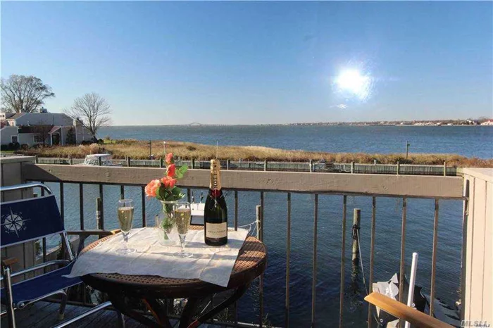Bay Front. 2 Story, in The Club w/ Boat directly behind your home.Enjoy Breathtaking Sunsets over the Great South Bay with the Captree Bridge as your back drop!. Just minutes to Fire Island and Fabulous Restaurants. Grounds Pristinely maintained with Tennis Courts, Heated IGP, Old Estate Club House w/ Billards, FirePlace, Piano Antique Bowling Alley & Squash Quart. Spacious Condo H/W.Floors, All redone, Fresh Paint, Wood Burning Stove, As Good As it Gets!! Sun and Fun! 6-12 months