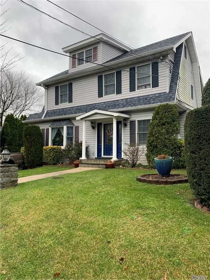 Charming Dutch Colonial in the North Shore School District. This spacious home was totally custom rebuilt in 2001, with extensions, all new electrical, 66k gal septic with 3 ring overflow and two drywalls. Enter this stunning home into a large living room with a gas fireplace, formal dining room, kitchen with custom cabinetry and built in&rsquo;s, gas cooktop and double oven, all with granite counters and new stainless appliances, wine cooler, skylights and mudroom, with an entrance to the back fully fenced in patio for entertaining around the heated covered above ground pool. In ground 4 sone sprinklers, 2 zone central A/C and 4 zone heat with UV lights in the ventilation system. Upstairs you will find 4 large bedrooms with two bathrooms, a master bedroom ensuite with a jacuzzi tub and jetted shower, a laundry room, attic fan with temperature sensor, and many more extras, a must see. Close to schools, shops, LIRR and transportation.