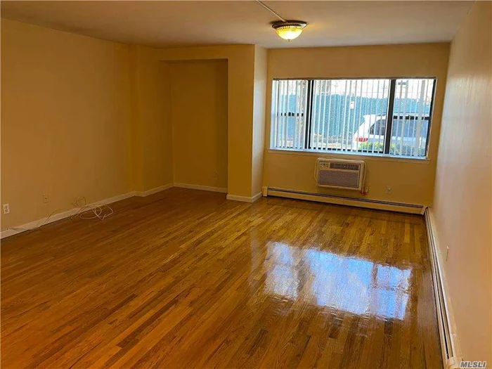 1st Floor (Walk in Level), Lovely and Move In Condition Condo features LR, EIK, 2 Bdrms, 2 Full Baths. Updated EIK w/Granite Counters, Many Cabinets, & Breakfast Bar Area. Beautiful Hardwood Floors Throughout! Updated Bathrooms w/Floor & Walls Tiles to Ceiling, New Glass Shower Doors. Washer/Dryer in Unit, 1 Parking Spot Included. Updated Electric w/Ceiling Fixtures in Every Rm. Large Storage Space in Bsmt Included. Plenty of Closets! Very Convenient Location, Close to Transportation & Shopping!