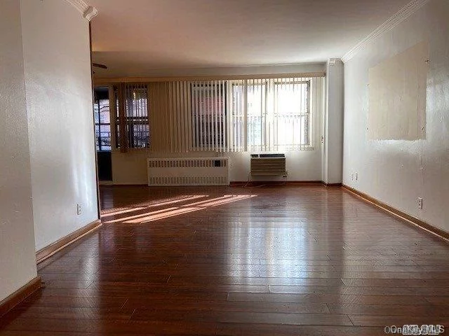 Very Well-Maintained Concrete High-Rise Co-op Building In the Heart of Flushing. Low Maintenance Includes All Utilities. Spacious Living-room with Large Windows Along with An Enclosed Terrace Allows for Year Round Enjoyment of Natural Light, Pass Through Kitchen Leads Into the Open Dining Alcove that Can Easily Fit A Dining-room Table For Six. The Master Bedroom Large Enough for A King/Queen Sized Bed and Furniture, Generous Closets and Walk in Closet. Building Amenities Include A Part time Doorman, New Laundry Room, Bike Room, Storage Room, Garage, Meeting/PingPong Room and Two Elevators. Conveniently Located to Everything You Need. Greenery of Nearby Queens Botanical Garden and Flushing Meadows Corona Park. Wide Selection of Restaurants, Supermarkets and Shopping Close By. MTA #7 Express, LIRR and Shuttle Van Provide Access to Manhattan, Brooklyn and Long Island.