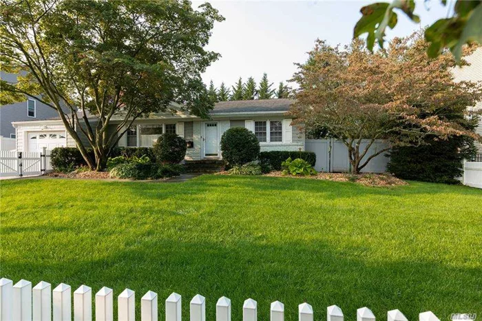 Wonderful North Syosset Flower section . Spacious LR/FPL and updated all white kitchen with granite counter top. Hard wood floors throughout and updated baths. First floor Master en-suite and playroom/family room in lower level with new flooring. Natural gas recently hooked up as well as access to sewers. In ground pool with paver surround and new deck and hook up for outside tv. Automated awning for shade over deck in highly desirable Syosset SD 2. Great location with easy access to village, trains, parkways, and LIE. Low maintenance home!!!