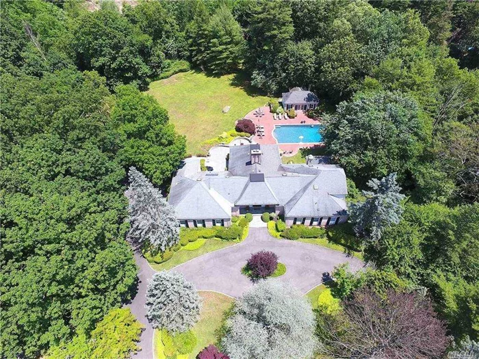 Located in the most coveted street in the prestigious village of Old Westbury at end of Cul-de- sac surrounded by verdant lawns and specimen trees is this magnificent brick home. Perfect setting for indoor and outdoor entertaining year round. Grand entrance hall leads to elegant living room and formal dining room with double fireplace and French doors opening up to the expansive covered outdoor patios with multiple seating areas, gunite pool, & updated cabana with bathroom & kitchen. This home boasts 6 bedrooms each with ensuite baths. Oversized master suite with fireplace and large eat-in-kitchen with stainless steel appliances, all with views of the park- like grounds.