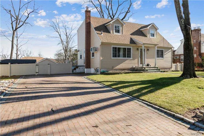 Spacious 4BR, 2.5 BA Cape on huge 80x100 lot. Optional for Manhasset or Great Neck South schools. Updated modern kitchen and baths, lower level is finished with walk-out separate entrance. Driveway for 4 cars, separate storage shed. Convenient location 3 blocks from Northern Blvd.